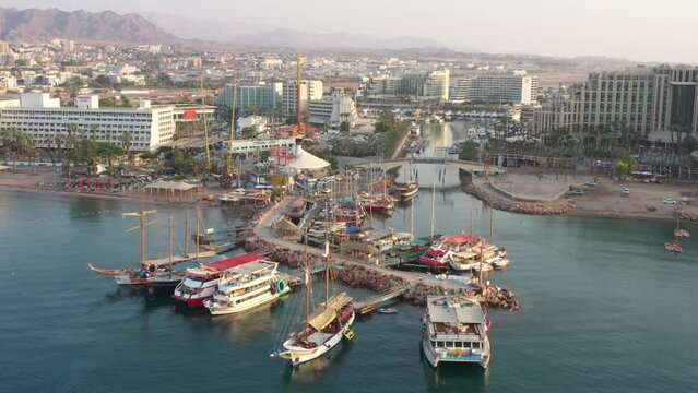 Yacht Port with hotels in the background in the desert ,Eilat,  Israel with cruises docked