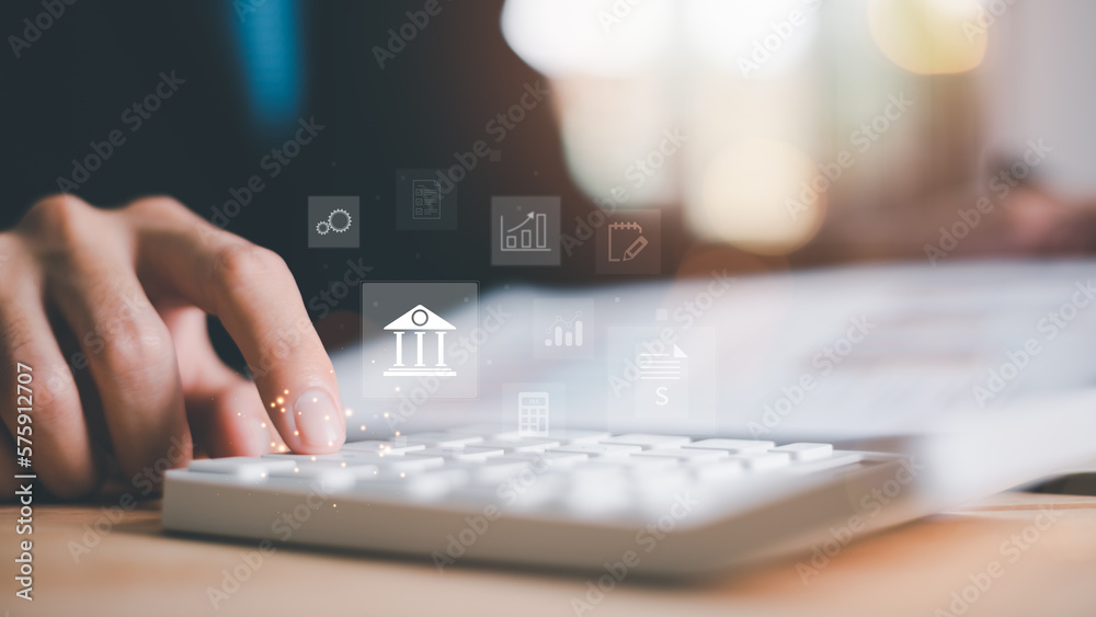 Poster businessman calculating figures in company financial documents with a calculator,analysis of company