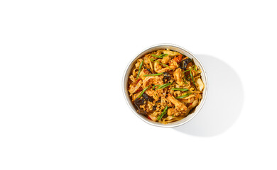 Asian fried noodles with shiitake mushrooms and vegetables isolated on white background Chinese fried noodles in vegetarian style in ceramic bowl. Stir-fry udon with vegetables and mushrooms