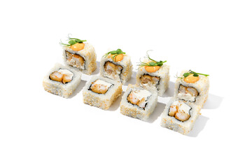 Maki sushi with sesame outside, tempura shrimp inside topped spicy sauce and microgreens. Spicy shrimp maki roll isolated on white background Trendy sushi roll with crispy prawn and hard shadows
