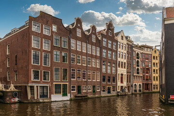 Fototapeta na wymiar Panoramic of a typical canal in Amsterdam in Holland in the Netherlands