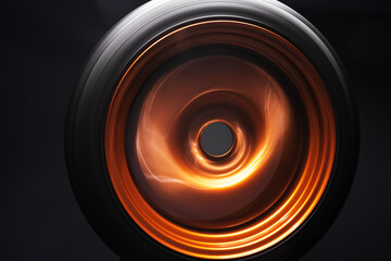 orange metal welded rims car wheels for a drift car custom tuning long exposure photo motion blur effect