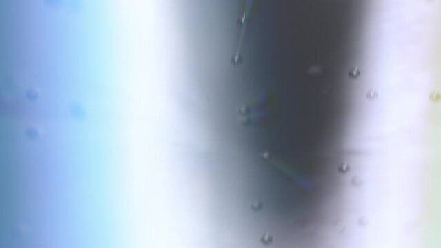 Abstract background with RGB separation and blurred radial. Liquid with fast moving bubbles. Concept for science, energy topics or fuel. Background in cold tones and fluid as gas liquid GPL and CNG