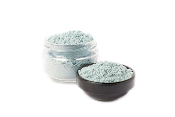 Blue spirulina powder in bowl isolated on white background. SUPERFOOD