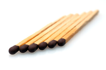 six matches used to make fire isolated on white background