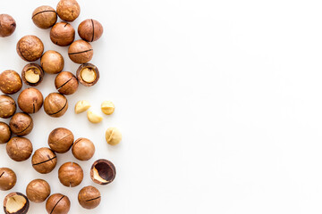 Obraz na płótnie Canvas Raw macadamia nuts food. Healthy protein snack background