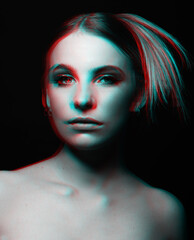 Beautiful woman portrait with nude make-up, classic hairstyle with blond hair bun tails and naked shoulders looking at camera. Red and blue color split and 3D glitch virtual reality effect applied