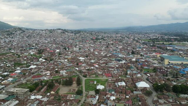 Aerial view of Mbeya city in Tanzania, Africa. Town located in south west of Tanzania. Narrow highland valley surrounded by a bowl of high mountains.