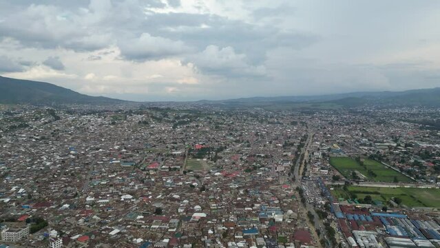 Aerial view of Mbeya city in Tanzania, Africa. Town located in south west of Tanzania. Narrow highland valley surrounded by a bowl of high mountains.