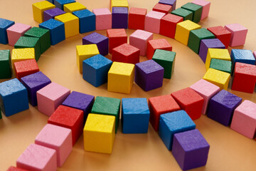 Fototapeta na wymiar Circle of colored cubes. Abstract concept of company structure and management.