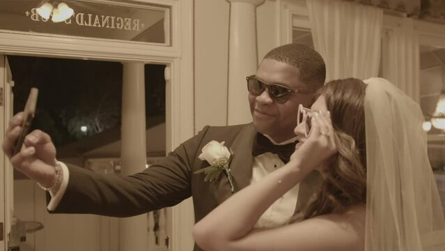 Bride and groom take fun selfie before they leave wedding venue. Fun. Shot in 4K 60 FPS. To purchase entire event raw at wholesale price email willneatheryyahoo.com.