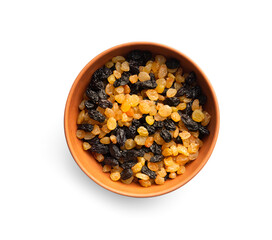 White and dark raisins in a clay bowl top view on a white background.