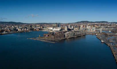 Oslo city in Norway - wide angle aerial  panorama scene- winter time - drone approaches the downtown area