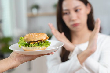 Close-up hands of a people reject to eat fast food for good health