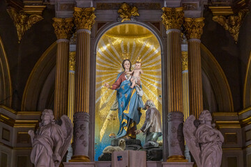 Our Lady's statue on the altar of the Sanctuary of Our Lady of the Guard (Madonna della Guardia) in the fog, in winter time, in Genoa, Italy.