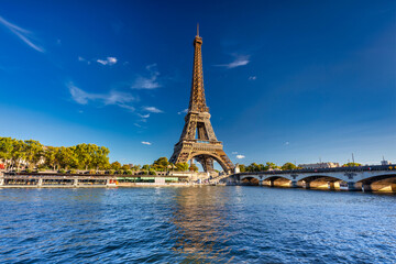 Fototapeta na wymiar Eiffel Tower by the Seine River in Paris at summer. France