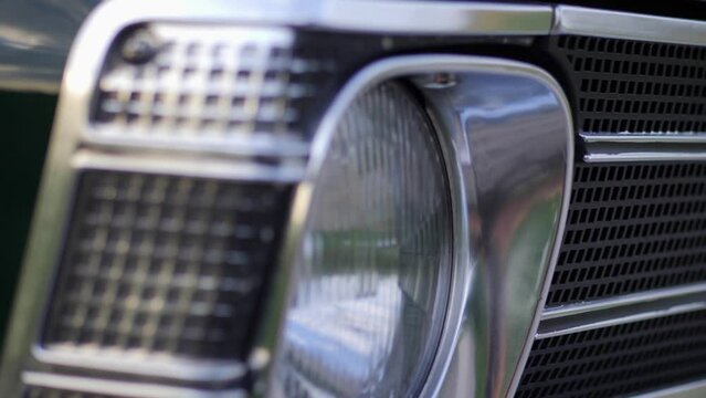 Opel Olympia classic car front lamp with Opel logo, parallax shot, 50 fps slow motion