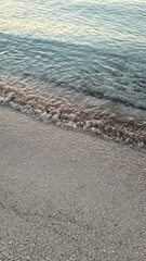 Beautiful beach at Alcudia Bay at sunrise. Ocean waves at sunrise. Ocean waves.