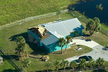 Hurricane Ian destroyed house in Florida residential area. Natural disaster and its consequences