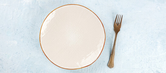 A white plate with a fork panorama, overhead flat lay shot, a panoramic banner for a restaurant menu