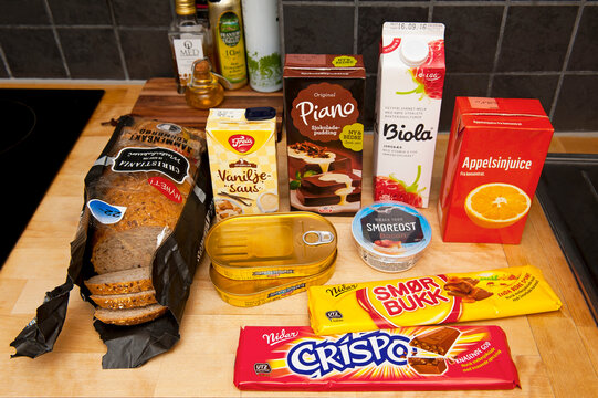 OSLO, NORWAY - AUGUST 26, 2016: Grocery shopping set of Norwegian food products in the kitchen. Inflation - rising living costs. Nutrition - health care, dieting and lifestyle.