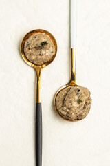 Truffle sauce with truffles and olive oil on a light background. vertical image. top view. place...
