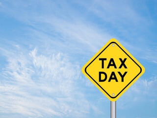 Yellow transportation sign with word tax day on blue color sky background
