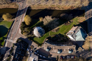 Top down urban aerial around former Dutch brick water tower in Zutphen now repurposed as a...