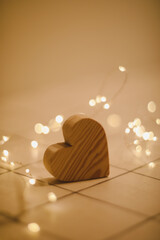 Valentines Day, Wedding concept - Wooden Heart by defocused blurred lights