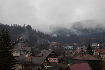 Clouds over the village houses on a late autumn morning