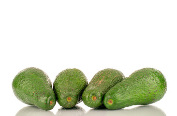 Four juicy avocados, macro, isolated on a white background.