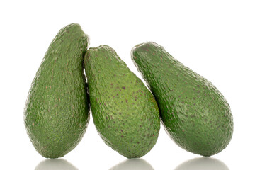 Three juicy avocados, macro, isolated on a white background.