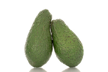 Two juicy avocados, macro, isolated on a white background.
