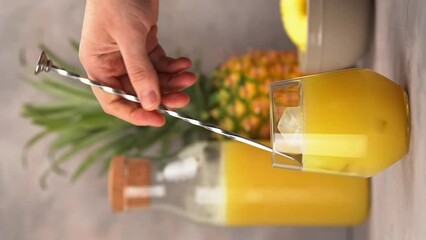 Rum cocktail with pineapple puree and coconut