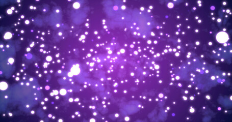 Abstract bright glowing festive purple circles with blur effect and energy magical bokeh on purple background. Abstract background