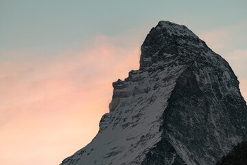 sunset over Matterhorn peak, you can see winds blow the snow, Zermatt - Switzerland