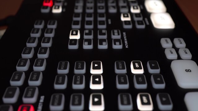 Professional digital video mixer with many buttons and settings. Control panel video channels macro. The camera makes a slide.