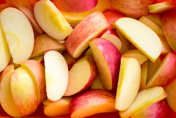 Healthy fruit concept. Fresh whole and sliced red apple, top view.
