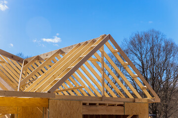 During construction new beam stick home wooden roof framework from trusses constructed