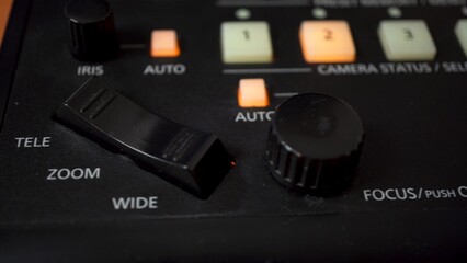 Black camera control panel. Remote control with buttons and joystick. Camera slow motion.