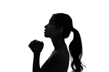 祈る女性のシルエット