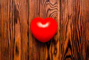 A symbol of love on brown wooden background
