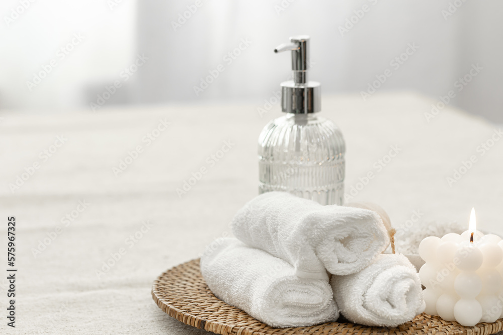 Poster Spa composition with towels, candle and soap dispenser.