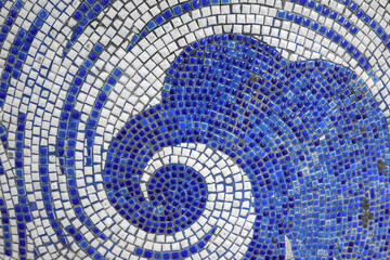 A great wave made of blue and white mosaics.