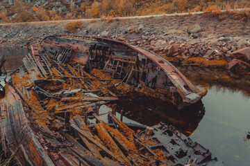 The skeleton of an old ship on the embankment