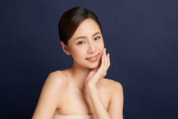 Beautiful young asian woman with clean fresh skin on blue background, Face care, Facial treatment, Cosmetology, beauty and spa, Asian women portrait.