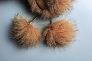 Fototapeta premium Details of a women's winter hat made of natural silver fox fur. Good background.