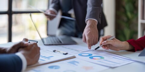 Team of business investment consultant analyzing company annual financial report working with documents pie and donut chart, using laptop, Business and Financial concept