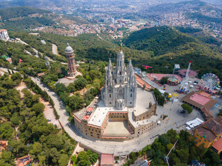 A panoramic bird's eye view of the Temple of the Sacred Heart of Jesus, Tibidabo Amusemsnt Park, and Tower of the Waters of Two Rivers, Barcelona, Spain