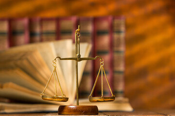 Law and justice concept. Mallet gavel of the judge, scales of justice, books. Copy space for text